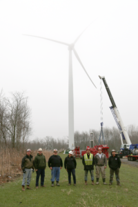 Native workers installing wind turbines on Seneca land provide innovative renewable energy solutions